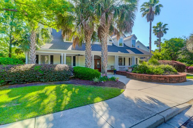 view of front of house featuring a porch and a front yard