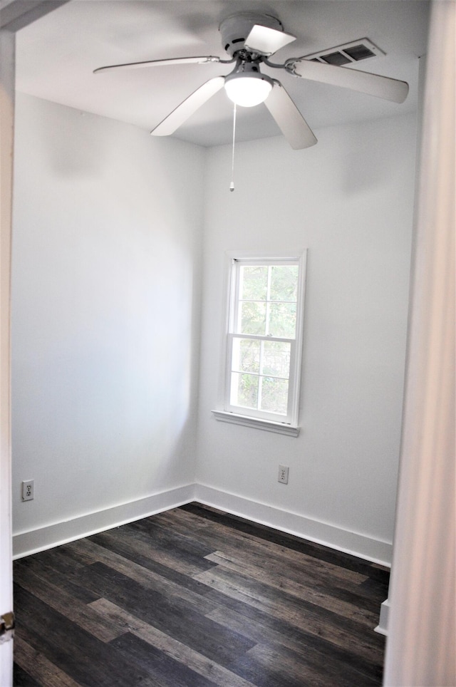 unfurnished room featuring dark hardwood / wood-style floors and ceiling fan