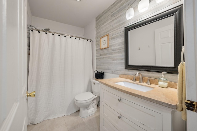 bathroom featuring tile patterned floors, a shower with curtain, vanity, toilet, and wood walls