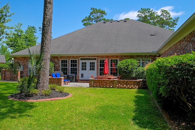 101 Firestone Ct, Summerville, SC 29483 - back of house featuring a patio, brick siding, a lawn, french doors, and a shingled roof
