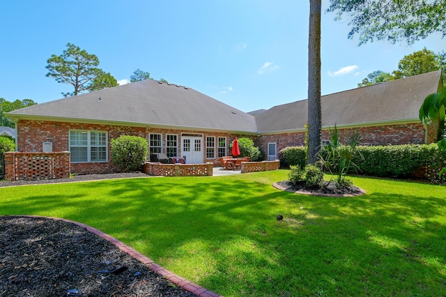 101 Firestone Ct, Summerville, SC 29483 - rear view of property featuring brick siding, a patio area, a yard, and french doors