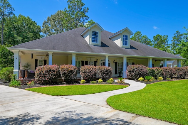 101 Firestone Ct, Summerville, SC 29483 - view of front of property with covered porch, a ceiling fan, a front yard, and stucco siding