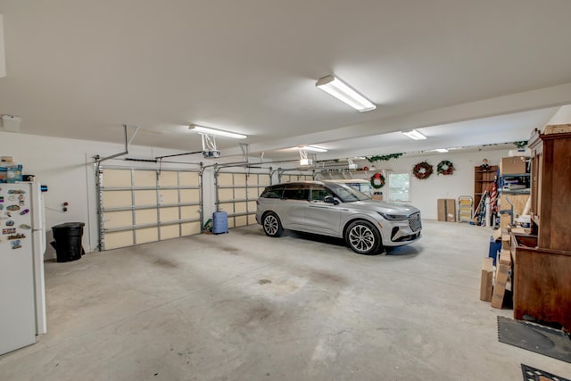 101 Firestone Ct, Summerville, SC 29483 - garage featuring freestanding refrigerator and a garage door opener