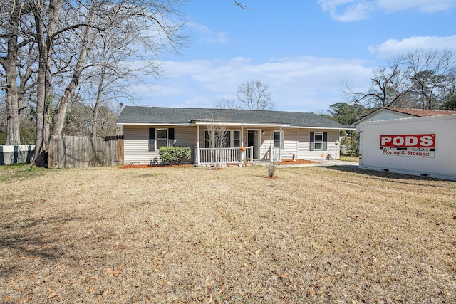 ranch-style house with a front lawn, fence, and a porch