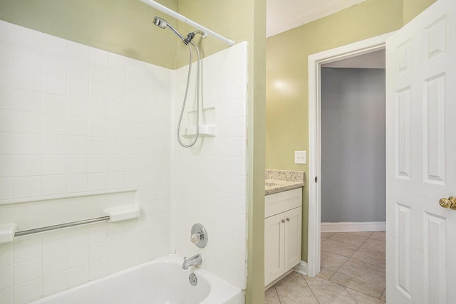 bathroom with  shower combination, vanity, baseboards, and tile patterned floors