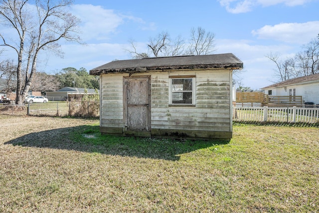 view of shed featuring fence