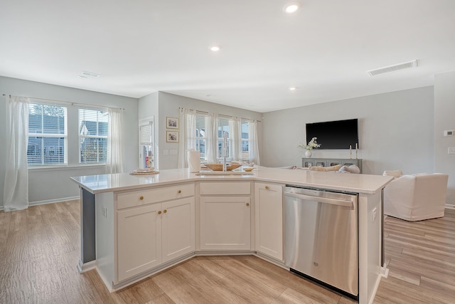 kitchen featuring open floor plan, visible vents, plenty of natural light, and stainless steel dishwasher