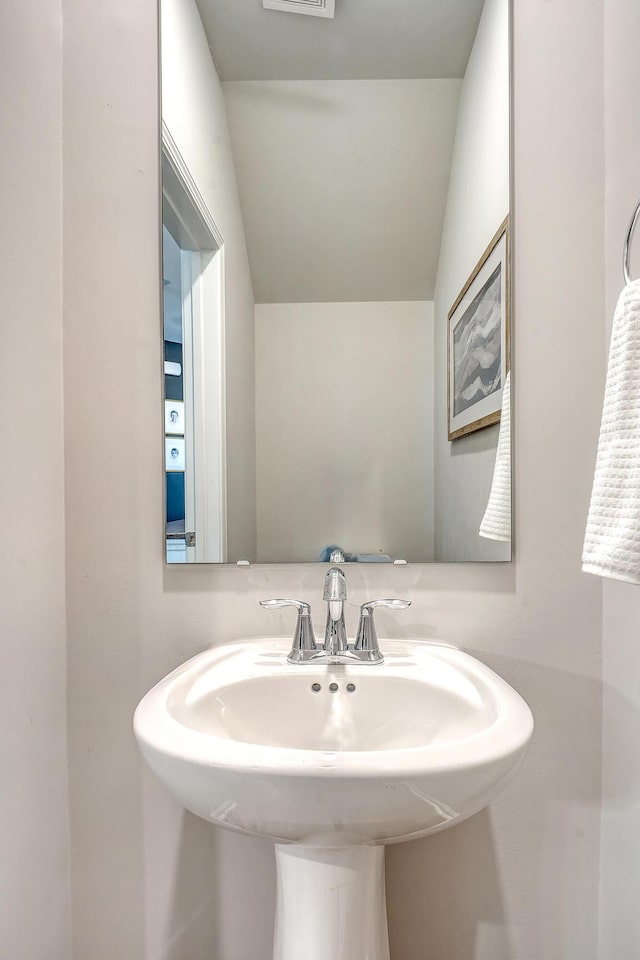 bathroom with a sink and visible vents