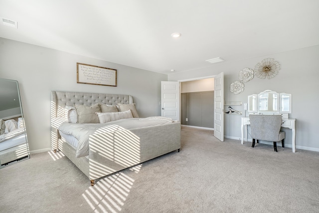 carpeted bedroom with visible vents and baseboards