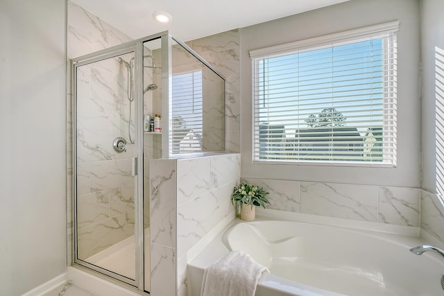 full bath featuring a stall shower, recessed lighting, and a bath