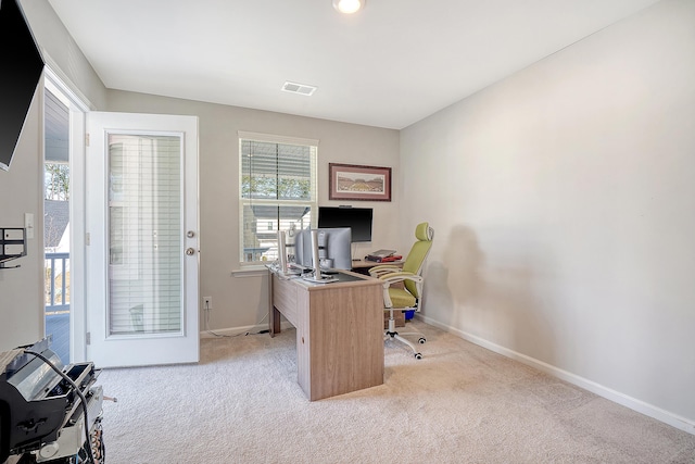 office with light carpet, baseboards, and visible vents