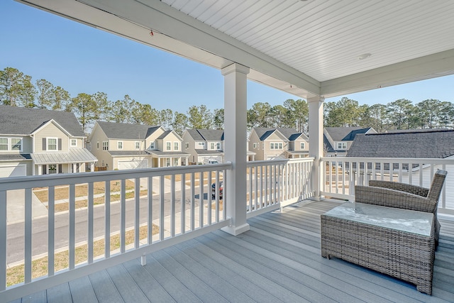 wooden deck with a residential view