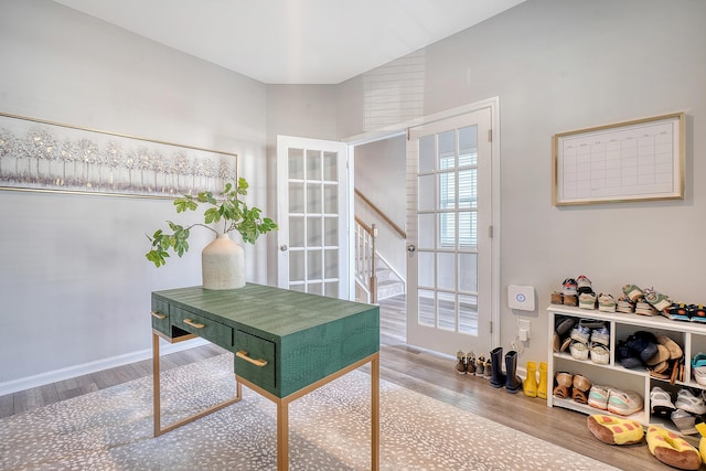 home office with wood finished floors and baseboards