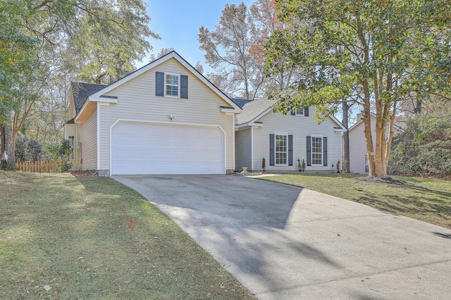 front facade with a garage and a front yard