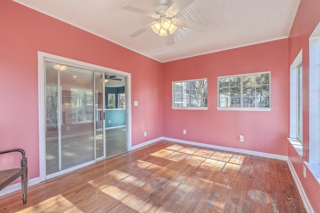 spare room featuring hardwood / wood-style floors and ceiling fan