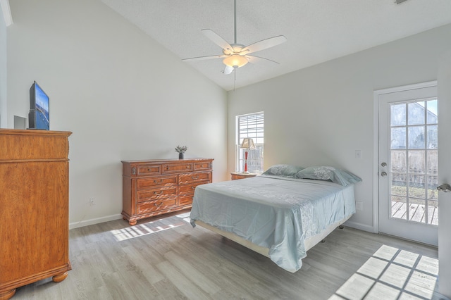 bedroom with light hardwood / wood-style flooring, ceiling fan, access to exterior, a textured ceiling, and vaulted ceiling