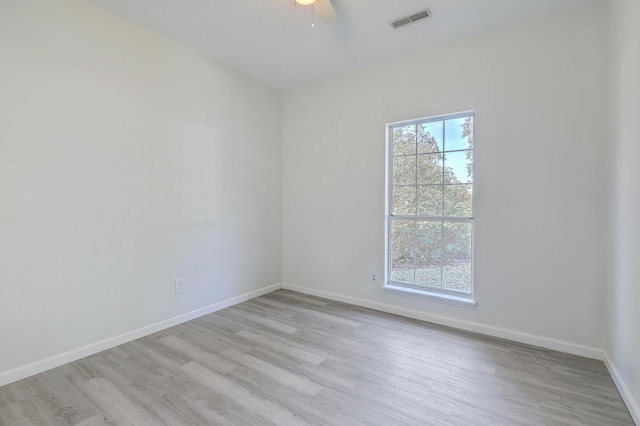 unfurnished room featuring light hardwood / wood-style floors and ceiling fan