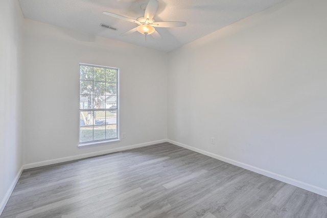 unfurnished room with ceiling fan and light wood-type flooring