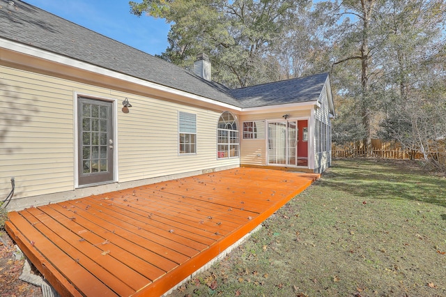 wooden terrace with a lawn