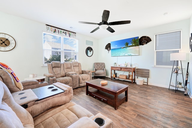 living room with ceiling fan and hardwood / wood-style flooring