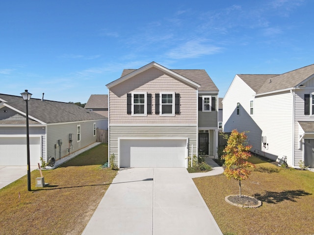 view of front facade with a garage and a front yard