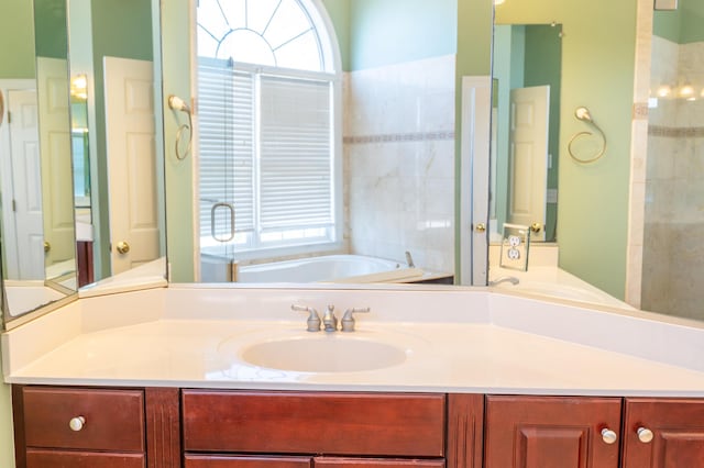 full bath featuring vanity and a bath