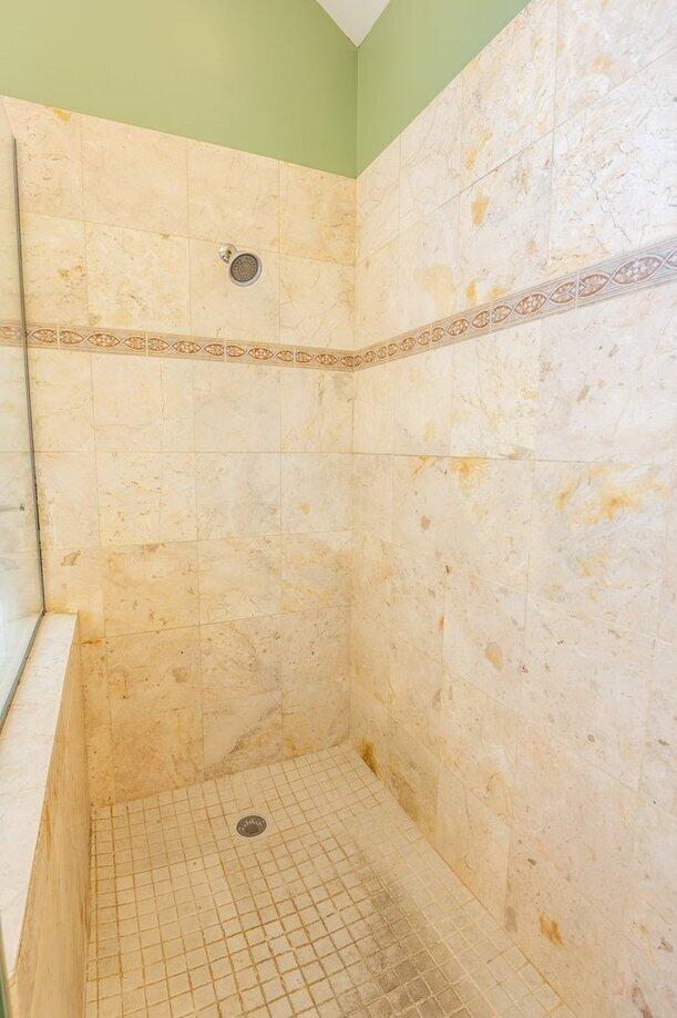 full bath featuring tiled shower