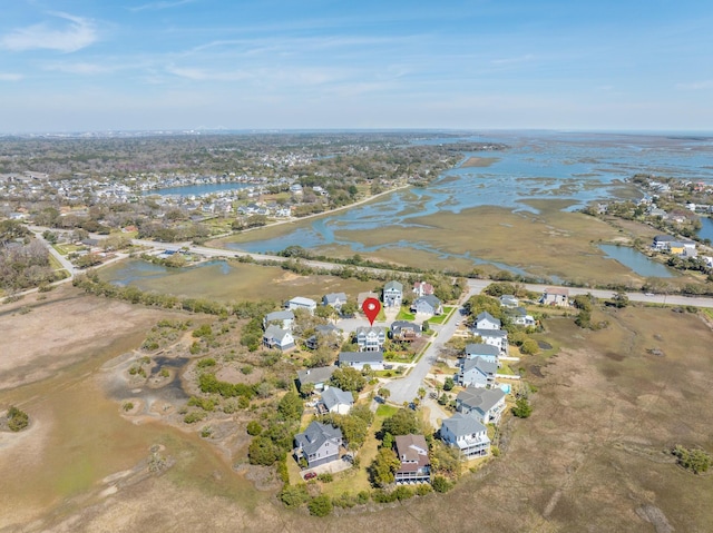 drone / aerial view with a water view and a residential view