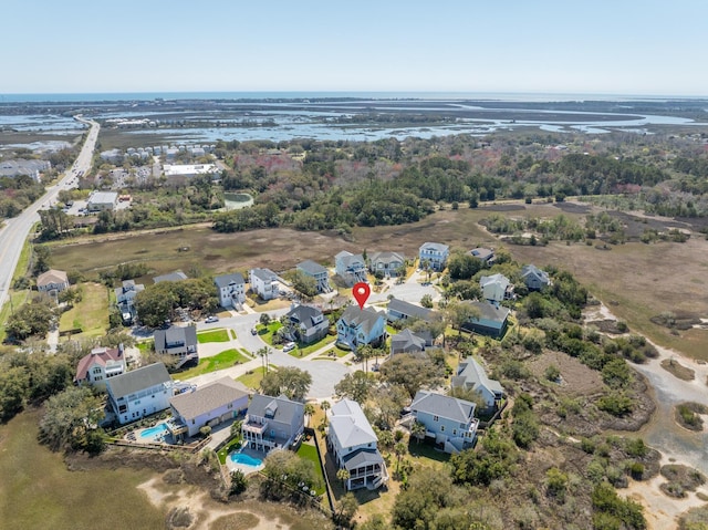 bird's eye view featuring a water view and a residential view