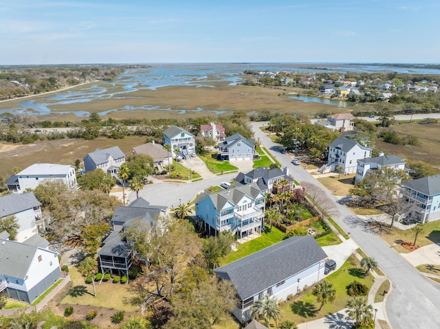 birds eye view of property with a residential view and a water view