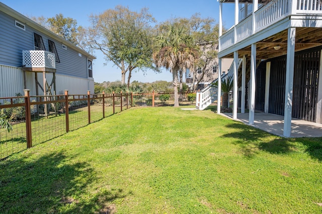 view of yard featuring a fenced backyard, stairs, a patio area, and a deck