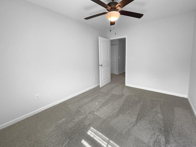 unfurnished bedroom with baseboards, carpet, and a ceiling fan