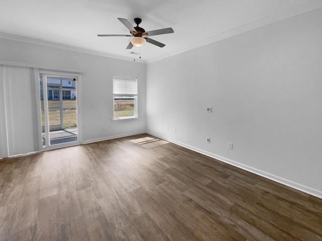 empty room featuring a ceiling fan, crown molding, baseboards, and dark wood-type flooring