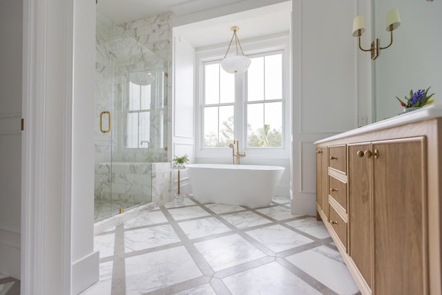 bathroom with tile flooring, shower with separate bathtub, and vanity