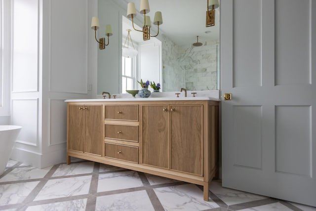 bathroom with dual sinks, large vanity, and tile floors