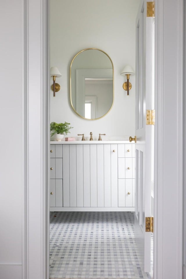 bathroom with vanity and tile floors