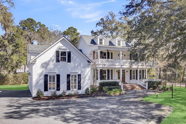 view of front of home with a balcony and a porch