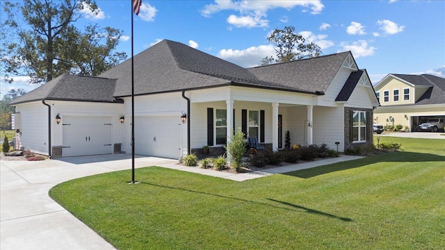 view of front of house featuring a garage, a front yard, a shingled roof, and concrete driveway
