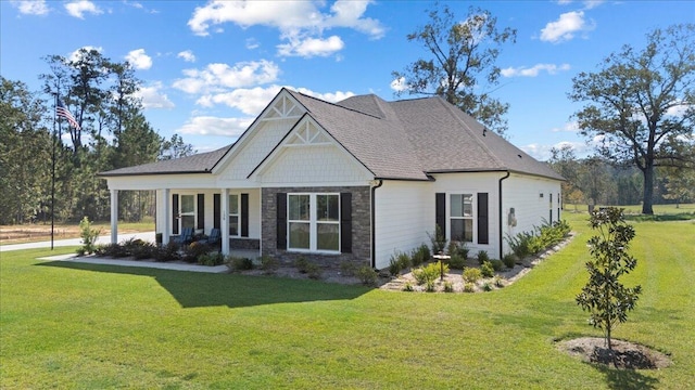 view of front of property featuring a front yard and stone siding