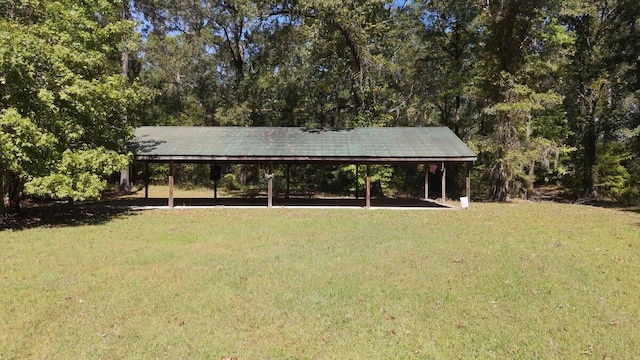 view of front facade with a front yard and a carport