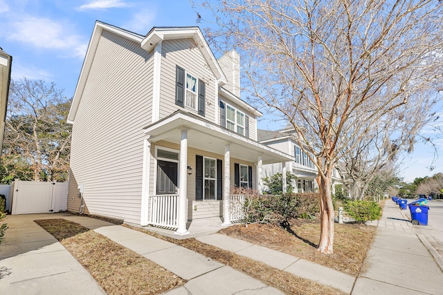 view of property with covered porch