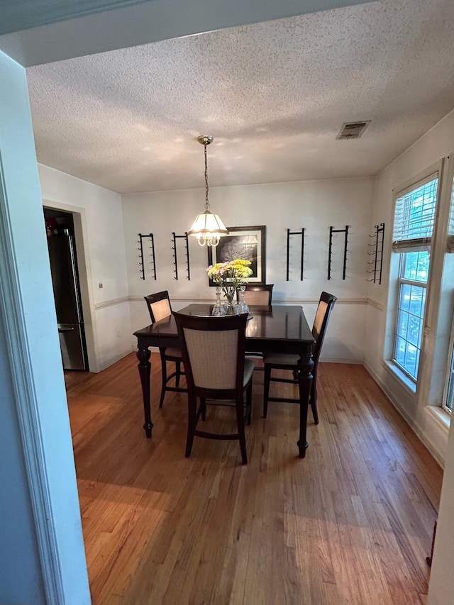 5423 Buckeye Rd, Hollywood, SC 29449 - dining space with wood finished floors and a textured ceiling