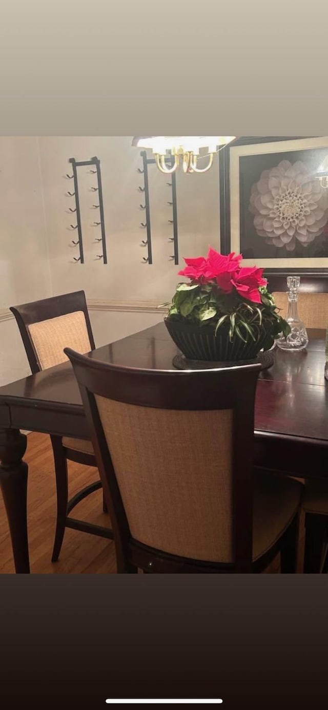 5423 Buckeye Rd, Hollywood, SC 29449 - dining room featuring wood finished floors and a chandelier