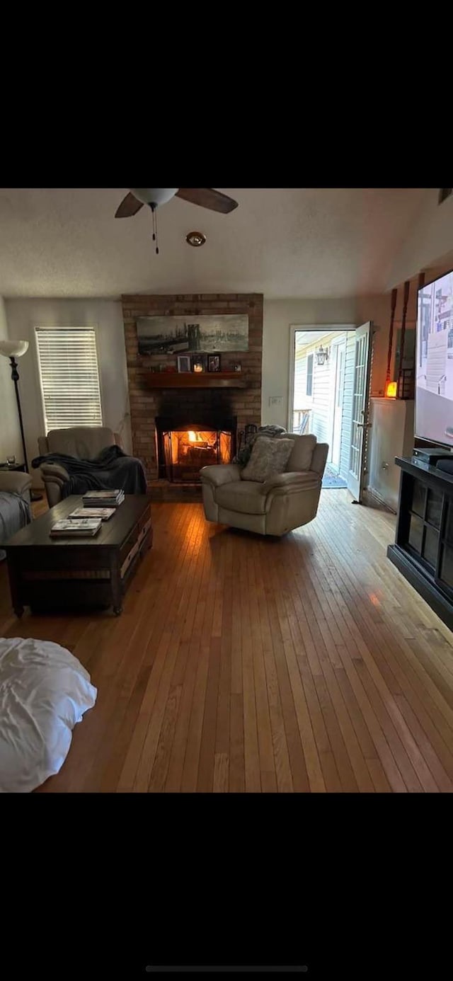 5423 Buckeye Rd, Hollywood, SC 29449 - living room with wood-type flooring, a fireplace, and a ceiling fan
