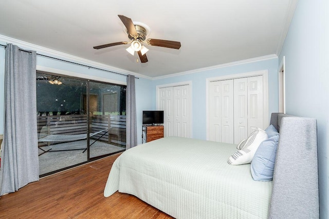 bedroom with ceiling fan, access to exterior, wood-type flooring, ornamental molding, and multiple closets