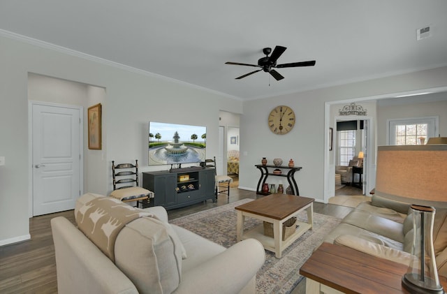 living room with ceiling fan, ornamental molding, and wood-type flooring