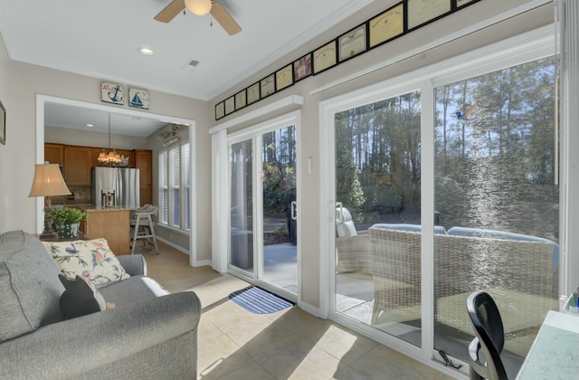 entryway with ceiling fan and light tile patterned flooring