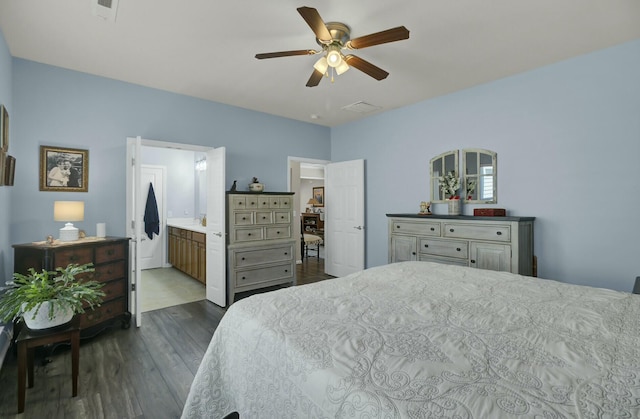 bedroom with dark hardwood / wood-style floors and ceiling fan