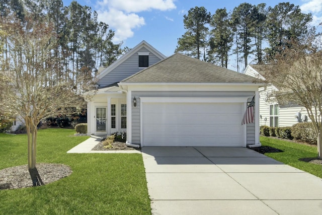 view of front of home featuring a garage and a front lawn