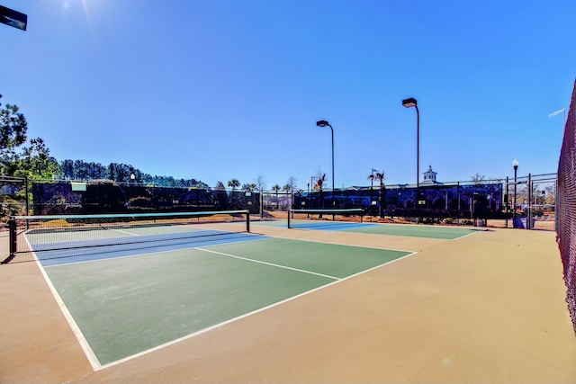 view of sport court with basketball hoop